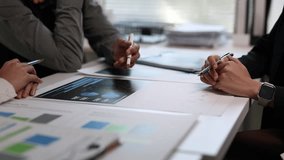 Business team are discussing financial data and reports during a meeting, using printed documents to analyze market trends and performance. - Powered by Shutterstock - Get 15% off with code: PIKWIZARD15