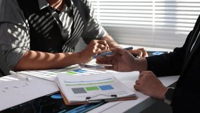 Business team are discussing financial data and reports during a meeting, using printed documents to analyze market trends and performance. - Powered by Shutterstock - Get 15% off with code: PIKWIZARD15