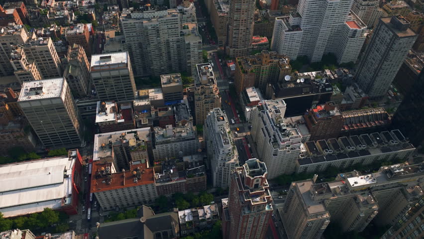 Aerial view descending above Lenox hill and Upper East Side, in sunny New York
