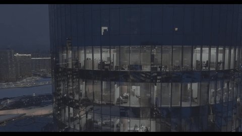 Drone Approaching Illuminated Business Center Night
