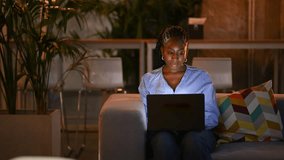 Two young african american coworkers having a discussion in a modern office lounge. Businesswoman showing project on laptop to male colleague - Powered by Shutterstock - Get 15% off with code: PIKWIZARD15