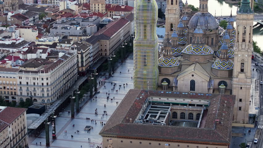 Aerial perspective of Cathedral Basilica of Our Lady of the Pillar and the historic city center of Zaragoza, Spain, with people walking