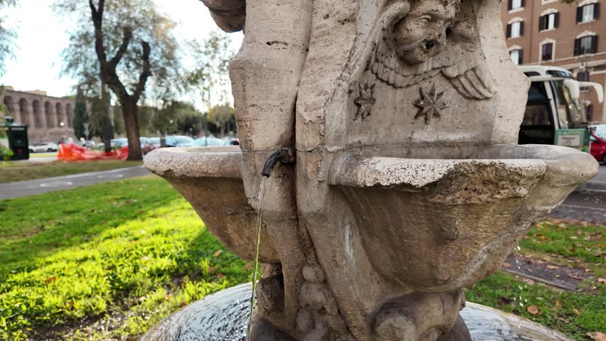A charming drinking fountain adorned with small angelic figures