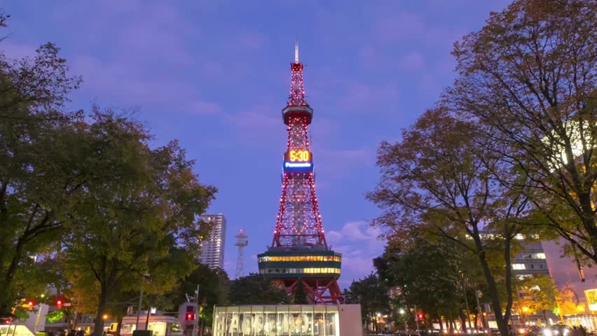 Sapporo tv tower illuminated at dusk in odori park hokkaido japan travel scene