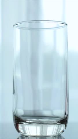 Stream of pure, clean drinking water filling a transparent glass, creating bubbles and refreshing splashes. The concept emphasizes hydration, health, purity, and thirst quenching