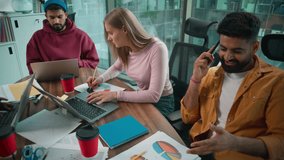 Four multiracial business diversity colleagues team men women working in informal startup office multinational teamwork African Caucasian businesswomen with laptops document Indian man talking phone - Powered by Shutterstock - Get 15% off with code: PIKWIZARD15