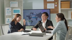 Group of cheerful Asian colleagues smiling and laughing together during a meeting in a modern office. Positive work culture, business team bonding, and relaxed corporate atmosphere. - Powered by Shutterstock - Get 15% off with code: PIKWIZARD15