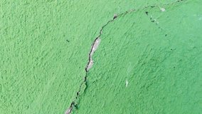 Cracked green wall texture with peeling paint - Powered by Shutterstock - Get 15% off with code: PIKWIZARD15