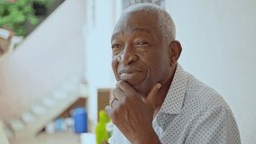 Senior Man Resting Chin On Hand With Thoughtful Expression Sitting On Porch Outdoors - Powered by Shutterstock - Get 15% off with code: PIKWIZARD15