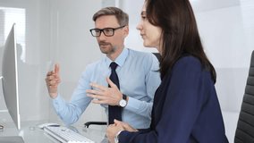 Business colleagues collaborating on computing project in office, discussing data, sharing ideas, and developing solutions, fostering teamwork and professional partnership - Powered by Shutterstock - Get 15% off with code: PIKWIZARD15