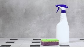 Cleaning Supplies In A Black Basket With Spray Bottles, Sponges, And Scrub Pad - Powered by Shutterstock - Get 15% off with code: PIKWIZARD15