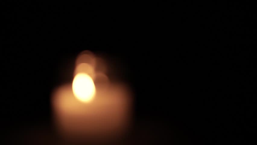 Jar Candle Flame Glowing Warmly in Darkness