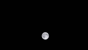Vertical video - Timelapse of full moon passing through night sky - Powered by Shutterstock - Get 15% off with code: PIKWIZARD15