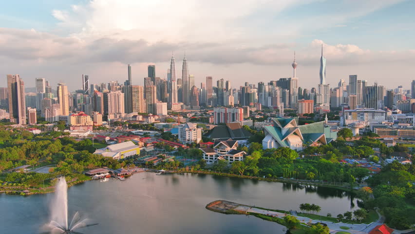 KUALA LUMPUR, MALAYSIA - 21.05.2023: Aerial view of capital city of Malaysia, modern skyline at sunset, perfect for travel, business, or development projects - landscape panorama of Southeast Asia fro