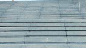 Empty, extended concrete staircase featuring curbstone-style steps. Horizontal stairway ascends from an underground level, offering an upward view. Staircase is constructed from solid cement concrete - Powered by Shutterstock - Get 15% off with code: PIKWIZARD15
