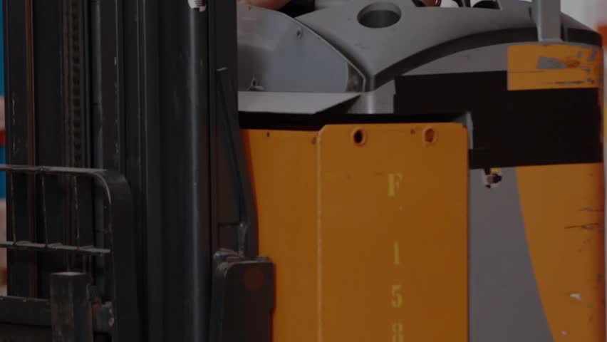 Forklift operator tapping tablet reviewing warehouse data as service icons drifting around controls. Industrial, technology, automation, logistics, digital, efficiency, operational - Powered by Shutterstock - Get 15% off with code: PIKWIZARD15