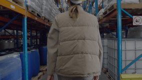 Warehouse inspector walking aisle activating rotating scan overlay highlighting inventory for audit. Industrial, logistics, technology, inventory, safety, efficiency, warehouse - Powered by Shutterstock - Get 15% off with code: PIKWIZARD15