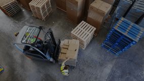 Forklift operator lifting pallet after ground supervisor cue, showcasing logistics data overlay. Logistics, industrial, teamwork, efficiency, automation, infrastructure, manufacturing - Powered by Shutterstock - Get 15% off with code: PIKWIZARD15
