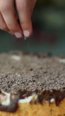 Sprinkle grated chocolate on top of the cake.