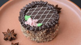 Sweet tart, pie with chocolate and cream with fruit filling on a plate. Chocolate tart dessert for a festive table - Powered by Shutterstock - Get 15% off with code: PIKWIZARD15