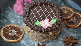 Sweet tart, pie with chocolate and cream with fruit filling on a plate. Chocolate tart dessert for a festive table - Powered by Shutterstock - Get 15% off with code: PIKWIZARD15