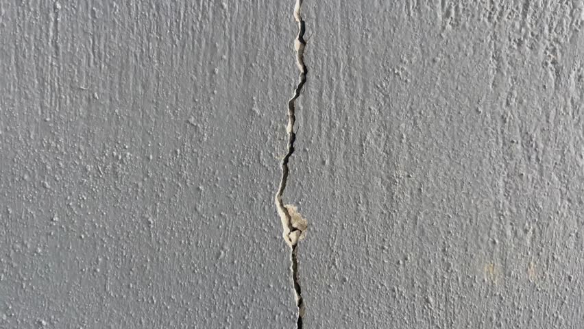 Cracked Plastered Wall Panning Downward 4K Stock Video
