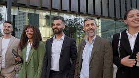 Group portrait of multi-ethnic business people team smiling together in front of their company office - Powered by Shutterstock - Get 15% off with code: PIKWIZARD15