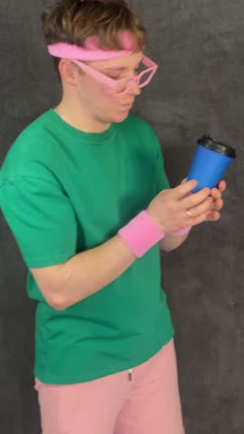 An attractive man drinks hot coffee