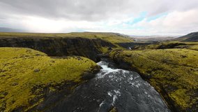 FPV drone diving dramatically over Haifoss, one of Iceland’s tallest and most breathtaking waterfalls. Rugged cliffs, and powerful cascades surrounded by untouched volcanic landscapes. Cinematic video - Powered by Shutterstock - Get 15% off with code: PIKWIZARD15