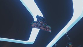 A futuristic Halloween scene glowing with neon lights, featuring a bright jack-o’-lantern pumpkin and flying bat decorations. The vibrant cyberpunk-style lighting combines spooky Halloween aesthetics  - Powered by Shutterstock - Get 15% off with code: PIKWIZARD15