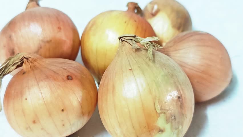 fresh raw onions isolated on white background.