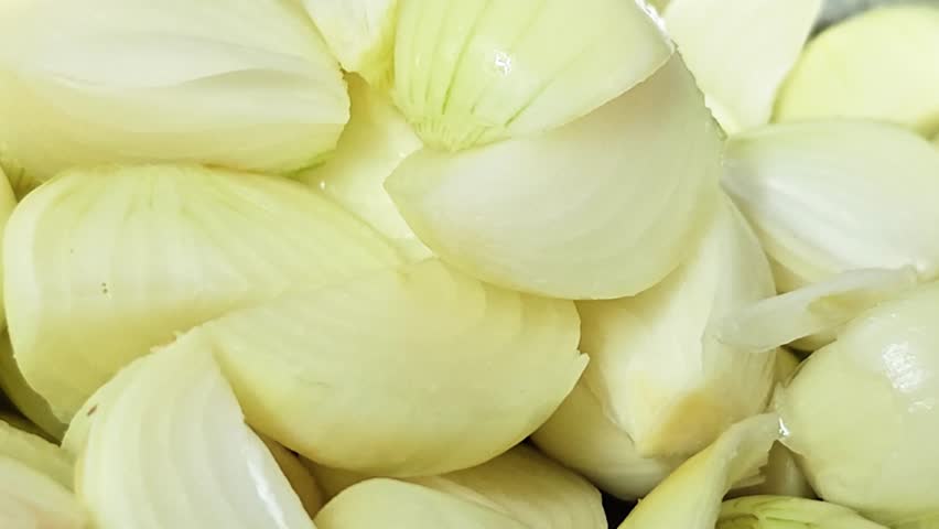 yellow onion sliced ​​onion on white background close up.