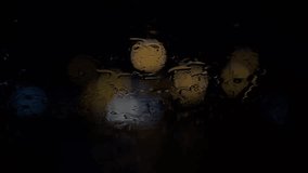 Driving in the rain in the city at night, the lights and bokeh reflect off the lights.	 - Powered by Shutterstock - Get 15% off with code: PIKWIZARD15