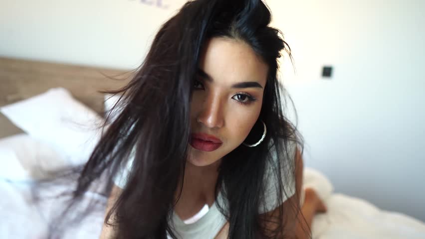 Face of Beautiful Sexy Asian Woman Posing in Bed, Slow Motion Close Up