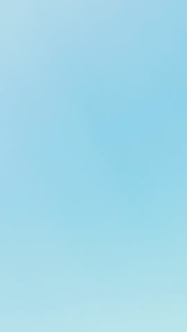 Card from below, against the sky, a horse jump, a thoroughbred beautiful brown stallion, a horse, with a girl rider, a jockey jumps over the barrier