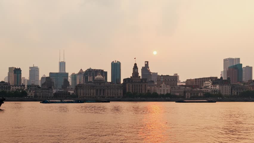 Time lapse view of the Bund urban modern and historical buildings in Shanghai city, China, Asia.