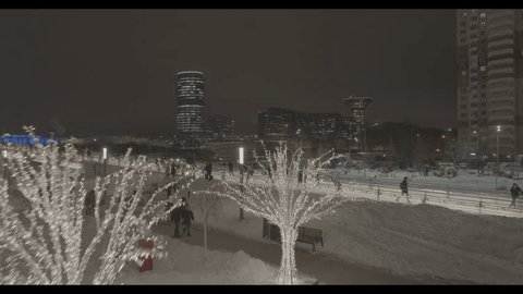 Drone Rising above Pavshinsky Bridge Glowing Urban