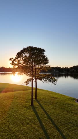 Aerial view of a peaceful lake by sunset  next to luxurious neighborhood by Woodlands lake , Houston, Texas.