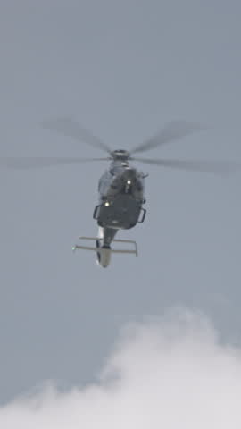 military helicopter performing combat flight maneuvers
