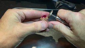 Intricate craftsmanship in jewelry repair with a focus on a ruby ring - Powered by Shutterstock - Get 15% off with code: PIKWIZARD15