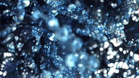 Abstract Plastic Beads Undulating 4K Loop features shiny glowing particles that look like plastic beads moving forward toward the viewer and back in a loop. - Powered by Shutterstock - Get 15% off with code: PIKWIZARD15