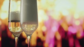 Champagne bottle pouring into flutes with golden foam and firework - Powered by Shutterstock - Get 15% off with code: PIKWIZARD15