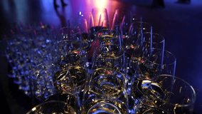 White and red wine in glasses at a party. Beautifully shiny glasses of white and red wine sparkle against the background of illumination. Wine glasses with good lighting. A waiter pours wine into - Powered by Shutterstock - Get 15% off with code: PIKWIZARD15