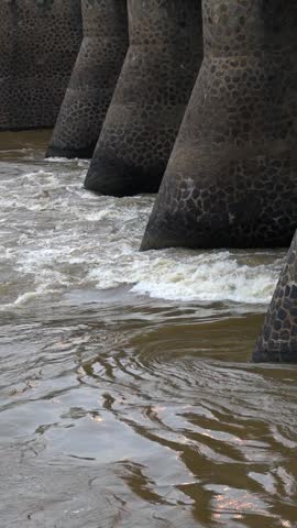 Water flowing violently from a large dam during the rainy season