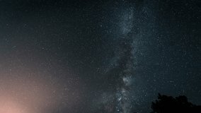 Beautiful starry night sky with Milky Way galaxy, exposure astrophotography, shining stars over dark forest trees mountain, space universe background, astronomy stargazing, cosmic nebula landscape - Powered by Shutterstock - Get 15% off with code: PIKWIZARD15