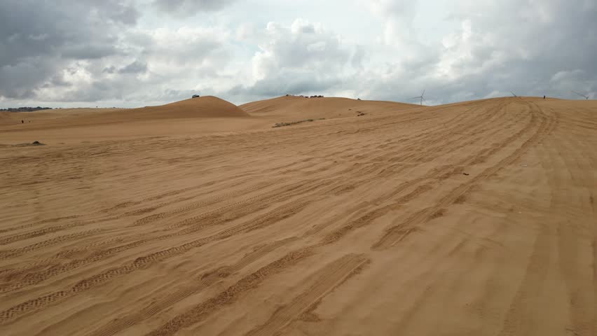 Take a trip to the golden sand dune desert and enjoy 4x4 car dune buggy  sand dune climbing in Mui Ne in South Vietnam on an adventurous trip in Asia