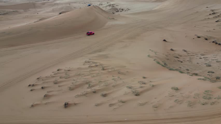 Take a trip to the golden sand dune desert and enjoy 4x4 car dune buggy  sand dune climbing in Mui Ne in South Vietnam on an adventurous trip in Asia