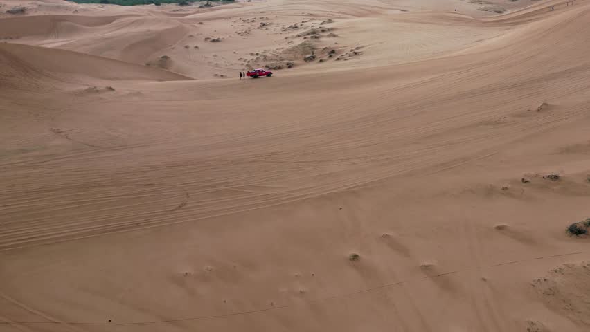 Take a trip to the golden sand dune desert and enjoy 4x4 car dune buggy  sand dune climbing in Mui Ne in South Vietnam on an adventurous trip in Asia