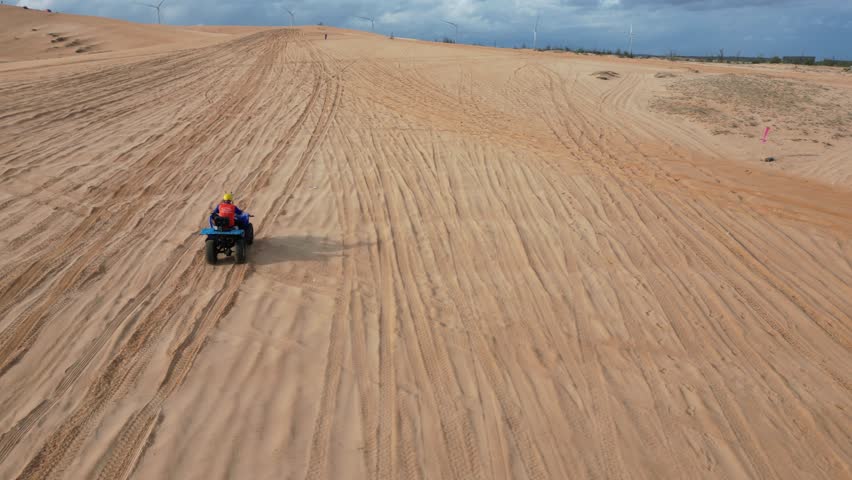 Take a trip to the golden sand dune desert and enjoy 4x4 car dune buggy  sand dune climbing in Mui Ne in South Vietnam on an adventurous trip in Asia