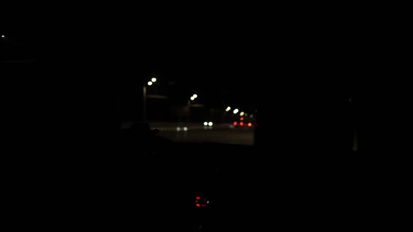 Night Drive POV Through Windshield with City Lights Ahead